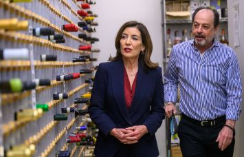 Governor Kathy Hochul visits VOS Selections wine store to discuss the impact of tariffs.