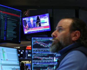 President Donald Trump's press conference on the Supreme Court's tariff decision is displayed on a television on the New York Stock Exchange.