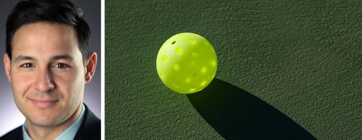 TF Cornerstone's Steve Gonzalez and a pickleball lying on a pickleball court.