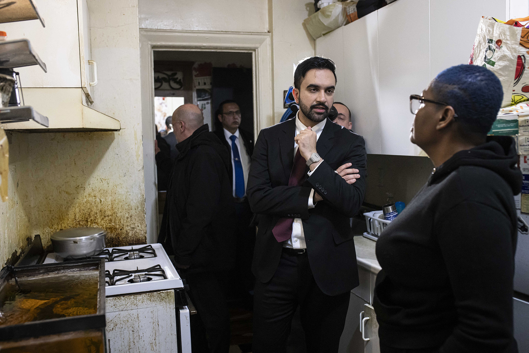 Mayor Zohran Mamdani speaks with Nadege Romulus (right) as he visits her apartment in the Prospect Lefferts Gardens neighborhood of Brooklyn.