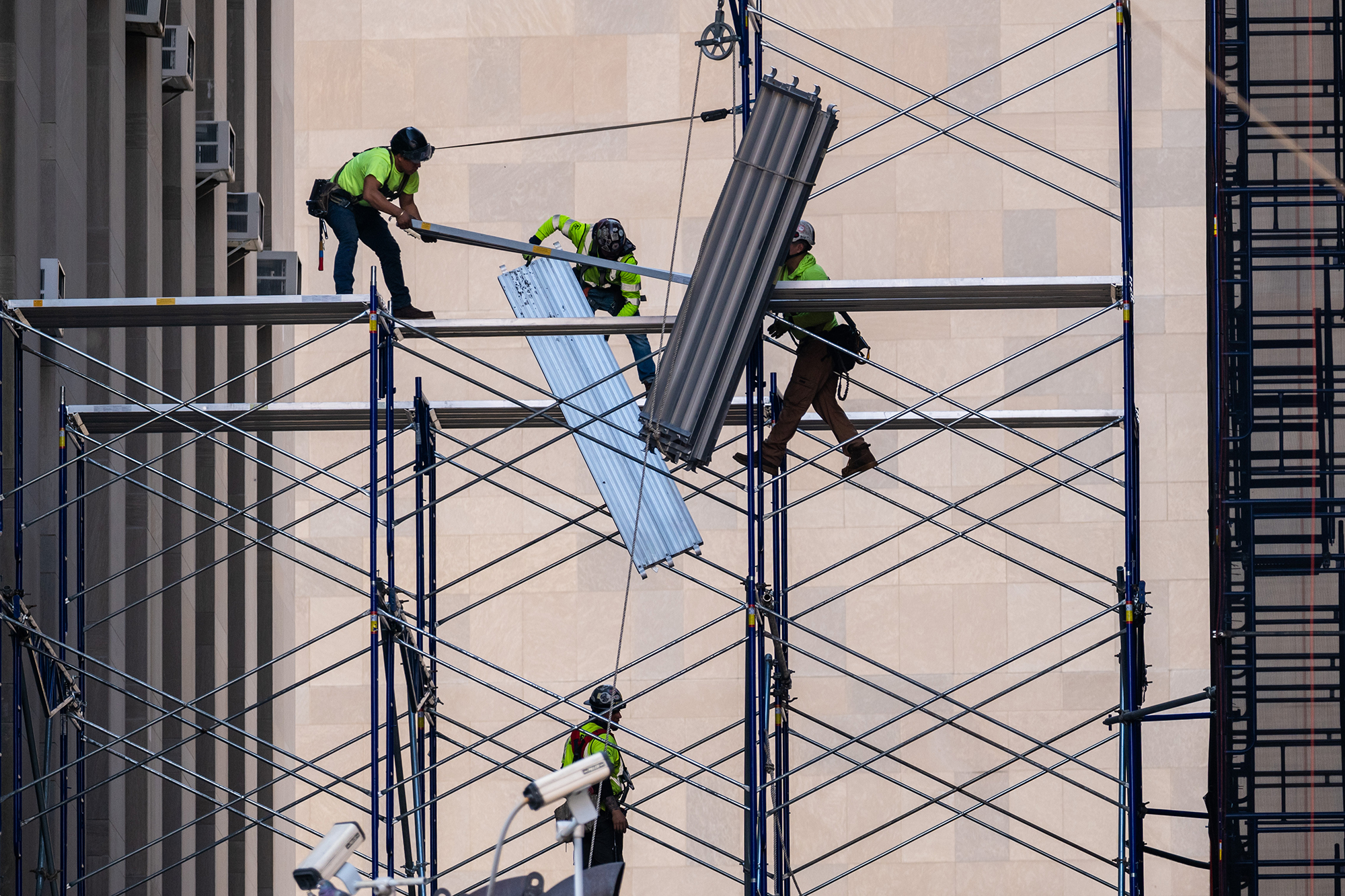 Workers proceed with the demolition of a building in Manhattan.