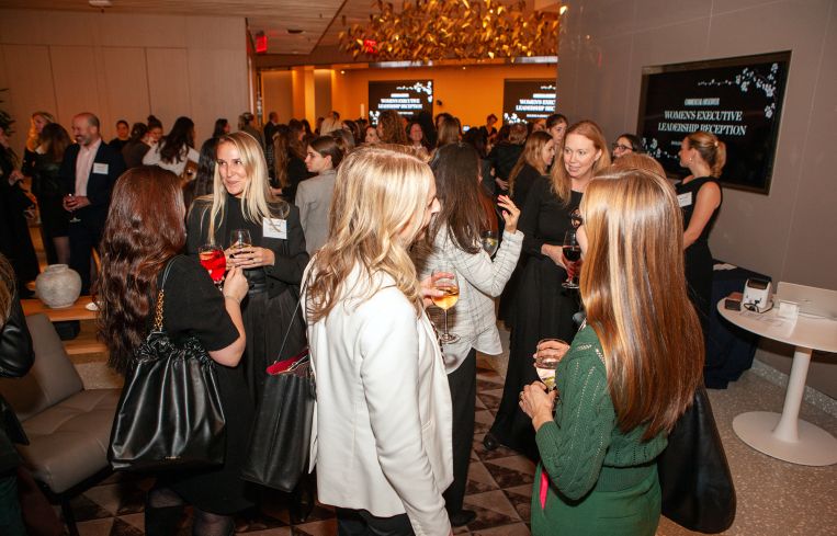 Networking at the Women's Executive Leadership Reception.