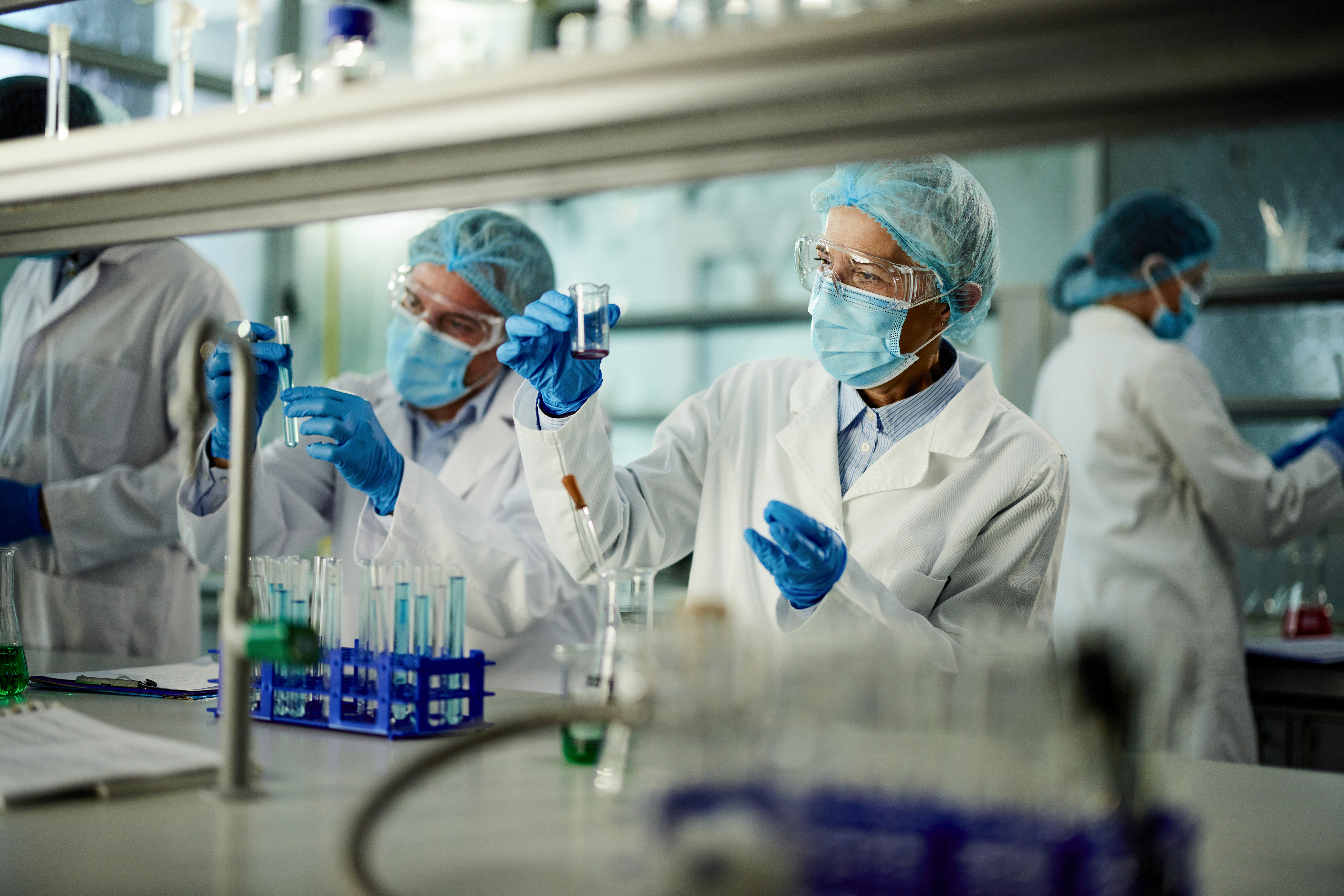 Team of scientists working on a research in laboratory.