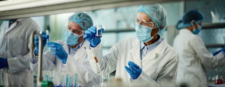 Team of scientists working on a research in laboratory.