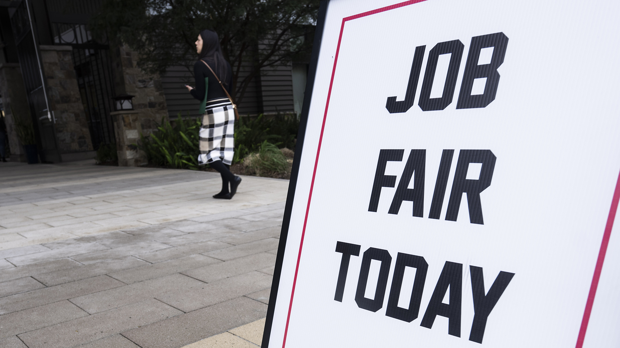 A sign advertises a job fair in Lake Forest, Calif.