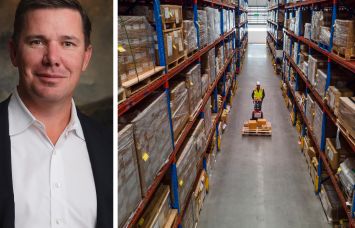 Harbert Management President and CEO Travis Pritchett and a worker moving a palette through a warehouse.