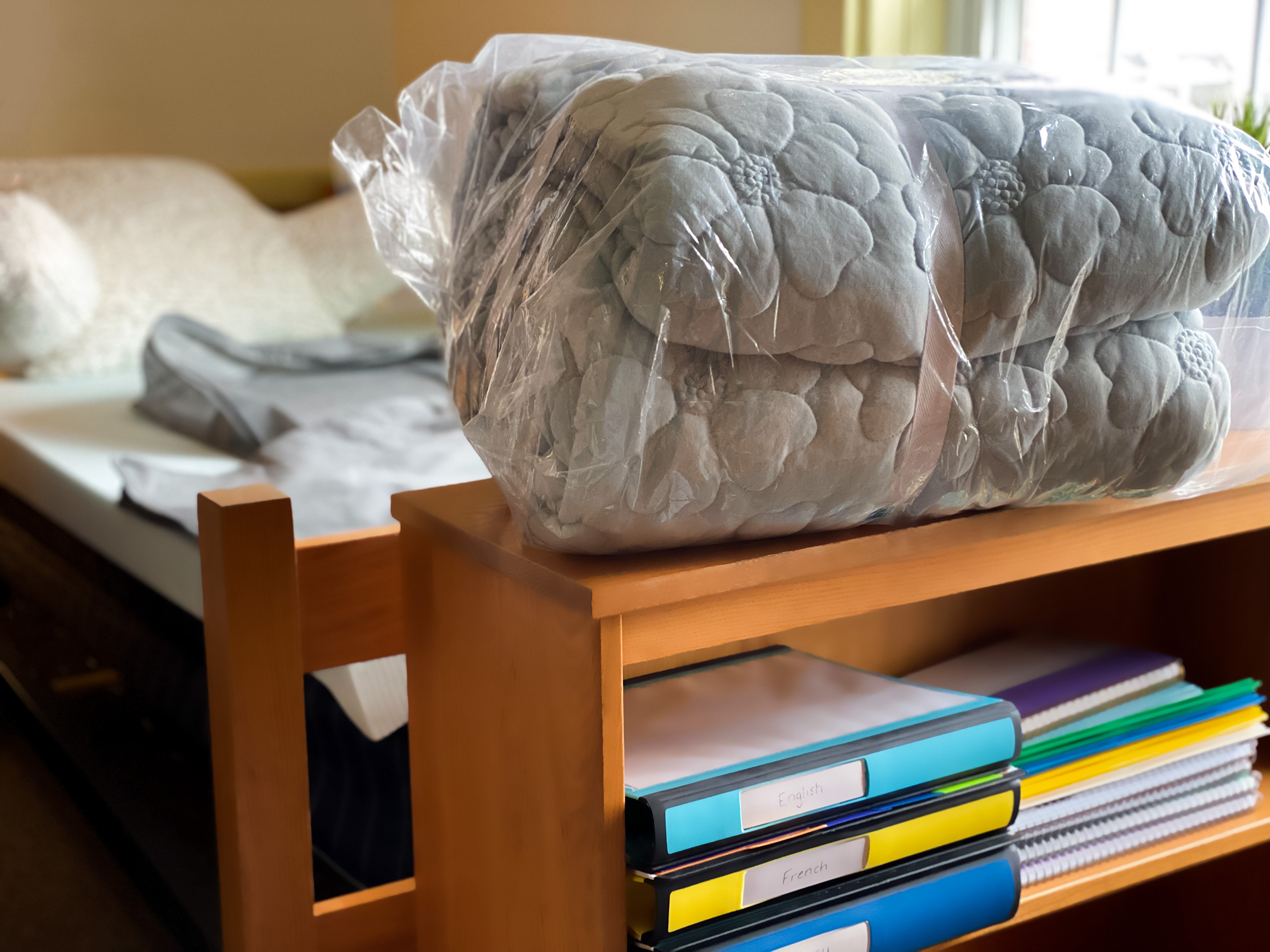 A dorm room with some supplies.