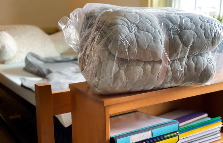 A dorm room with some supplies.