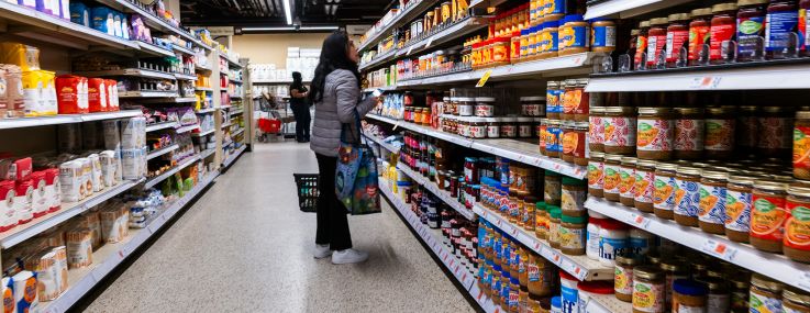 People shop at a grocery store.