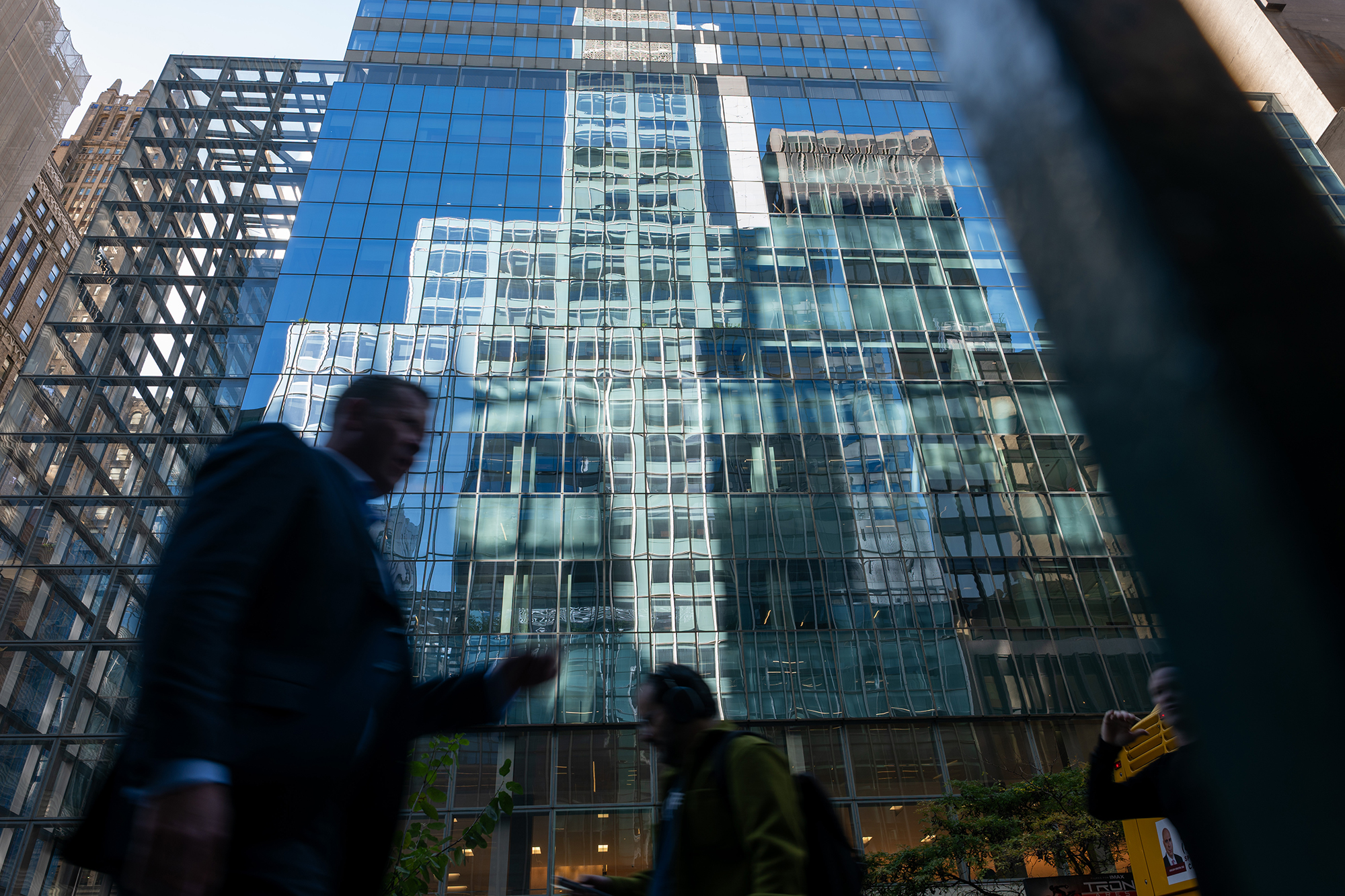 Crowds walk through midtown Manhattan.
