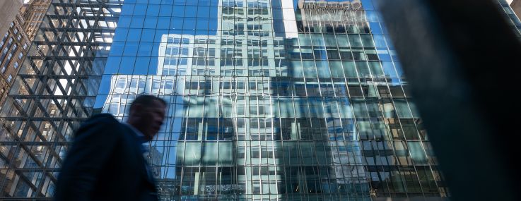 Crowds walk through midtown Manhattan.