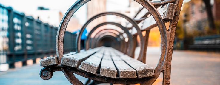 A park bench on a promenade.