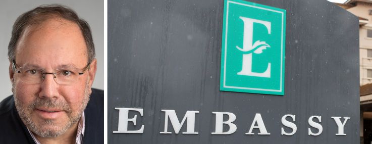 Joe Lubeck, Hilton Embassy Suites sign.