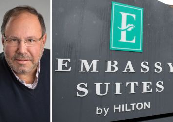 Joe Lubeck, Hilton Embassy Suites sign.