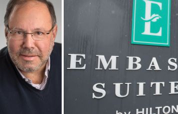 Joe Lubeck, Hilton Embassy Suites sign.