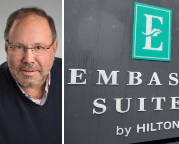 Joe Lubeck, Hilton Embassy Suites sign.