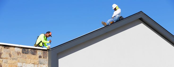 Workers continue construction on the Marcel Gardens shopping center in Fulshear, Texas, outside of Houston in 2024.