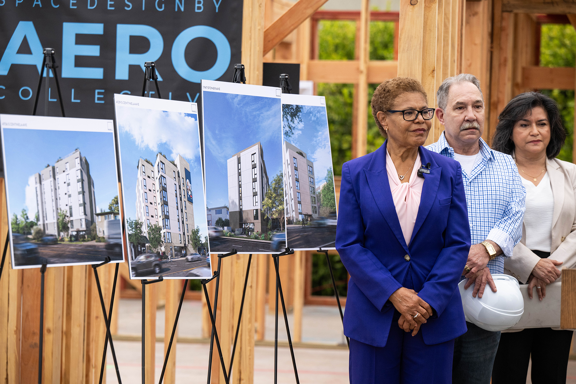Mayor Karen Bass, Veteran David Sinatra and Lourdes Castro Ramirez, president and CEO of Housing Authority of the City of Los Angeles, during a press conference on affordable housing at a construction project for affordable veteran housing on Barrington Avenue in West Los Angeles.