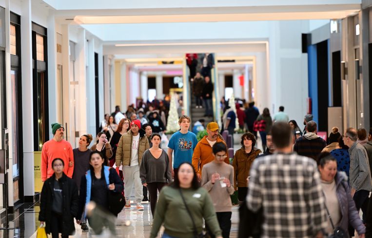 Shoppers walk through the King of Prussia Mall in King of Prussia, Pa.