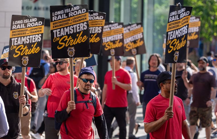 Long Island Rail Road (LIRR) workers picket in front of Penn Station.
