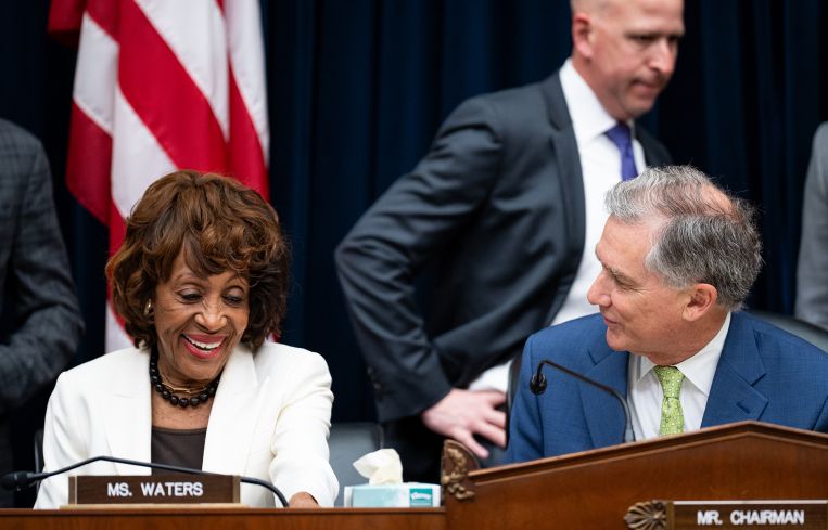 Rep. Maxine Waters, D-Calif., and chairman Rep. French Hill, R-Ark., talk before the start of the House Financial Services Committee hearing in 2025.
