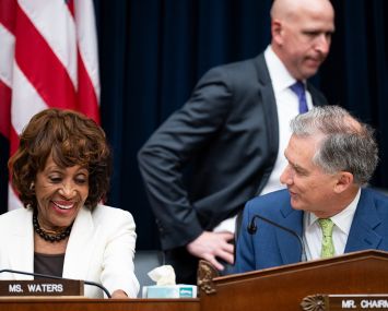 Rep. Maxine Waters, D-Calif., and chairman Rep. French Hill, R-Ark., talk before the start of the House Financial Services Committee hearing in 2025.