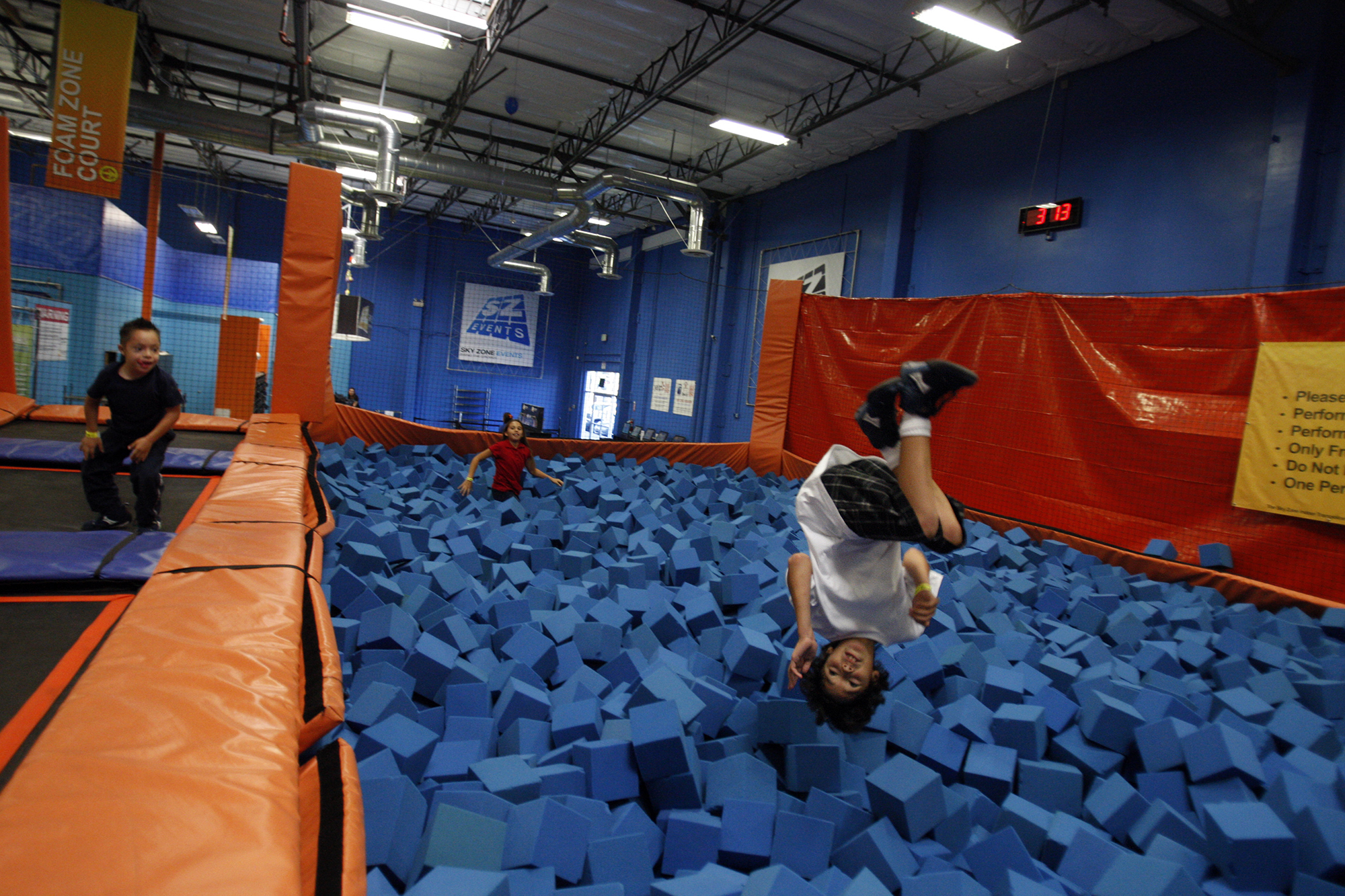 Kids play in a foam pit in the Foam Zone area of Sky Zone in Anaheim.