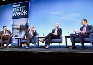 Sumit Roy (from left), president and CEO of Realty Income Corporation; Seth Carpenter, chief global economist at Morgan Stanley; Joseph Lupton, co-head of economic eesearch at JP Morgan and Andy Richard, co-head of global real estate banking at Citigroup.