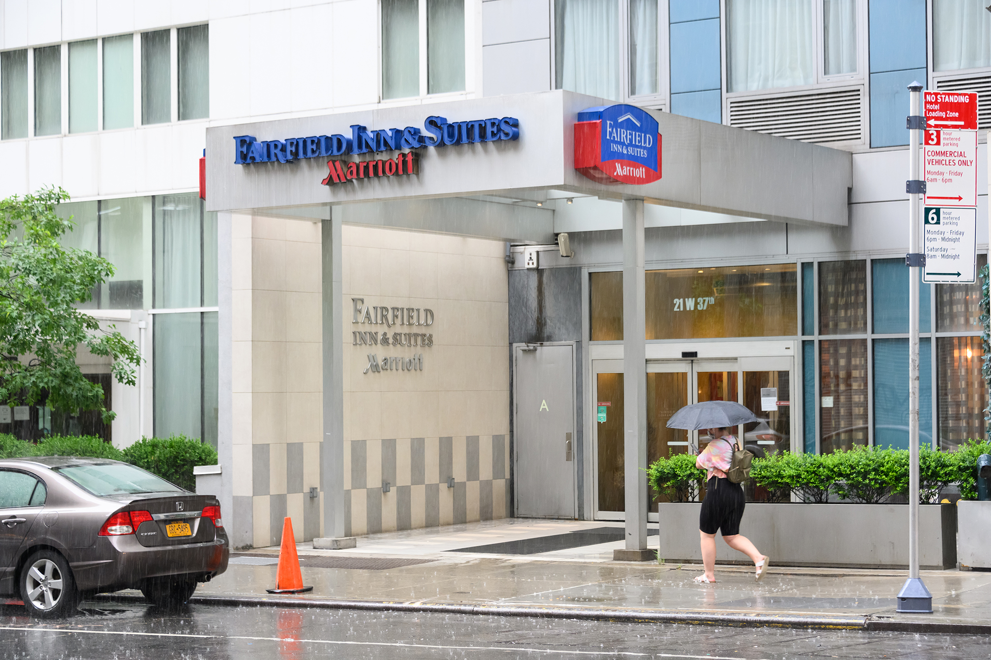 A person walks outside Fairfield Inn & Suites by Marriott at 21 West 37th Street.