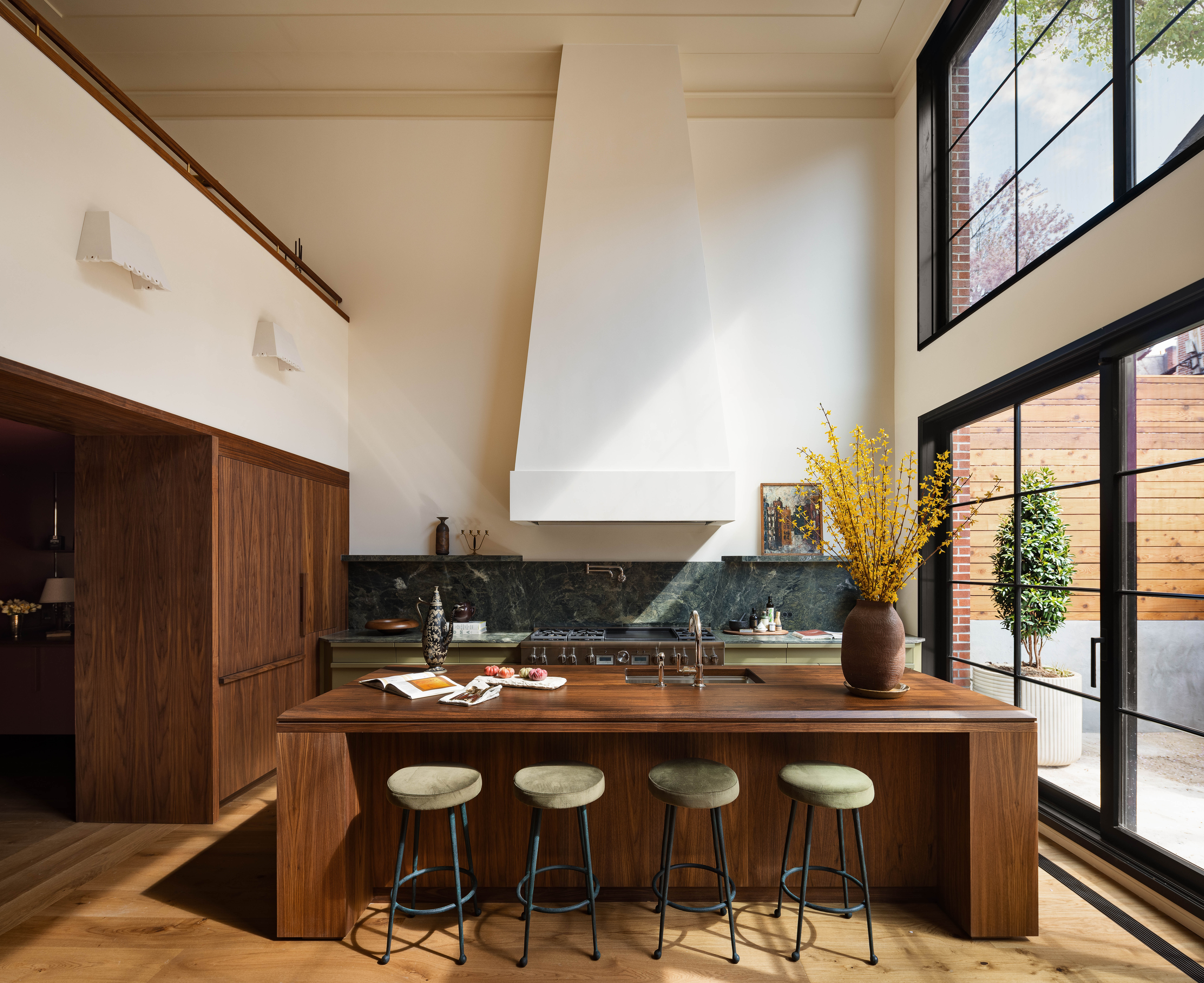 The lower floor kitchen features a huge sliding glass wall that opens to the backyard.