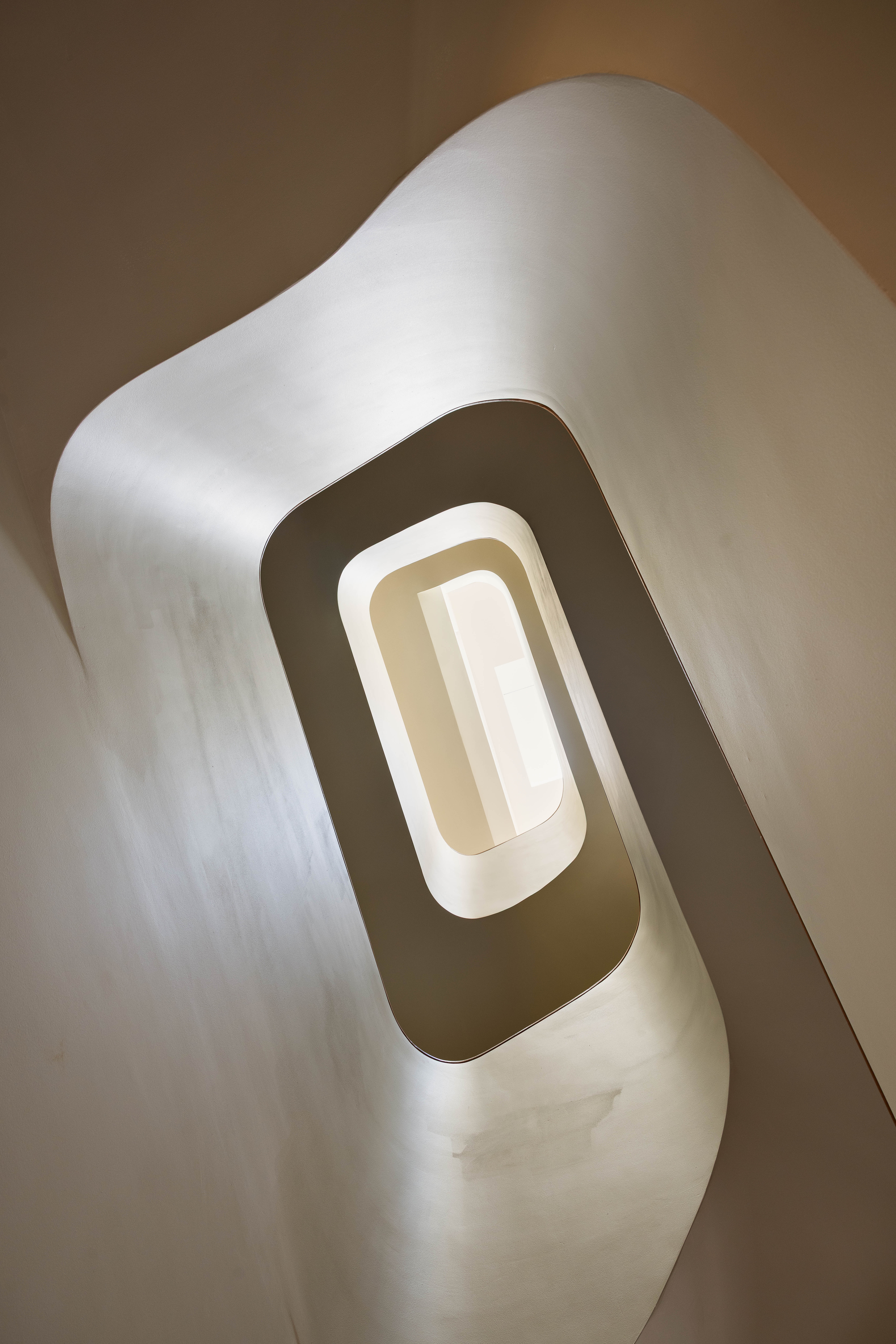 The staircase is a work of art, with a Guggenheim-style spiral.