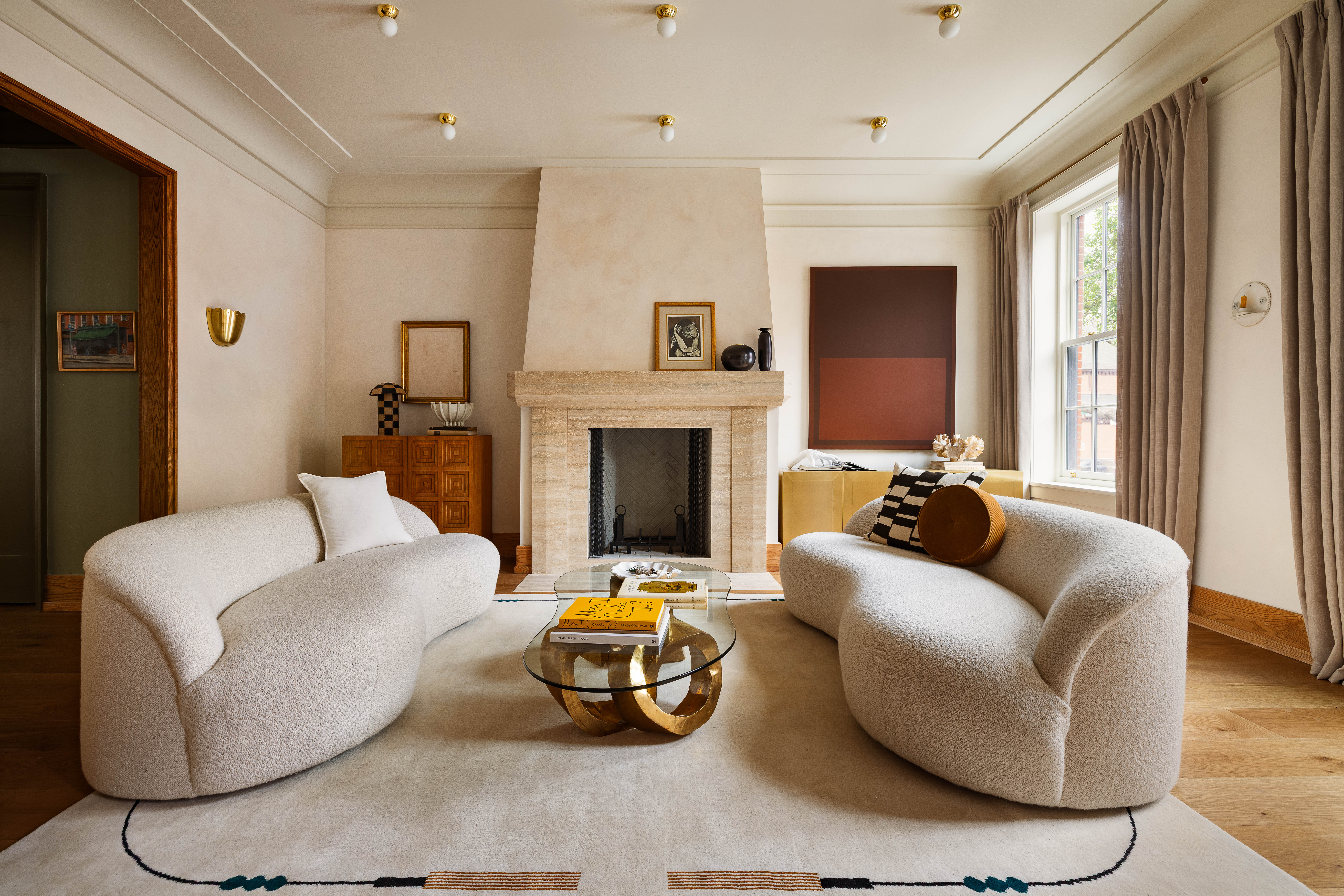 There are two living rooms on the first floor, one overlooks the kitchen and the other has a wood burning fireplace.