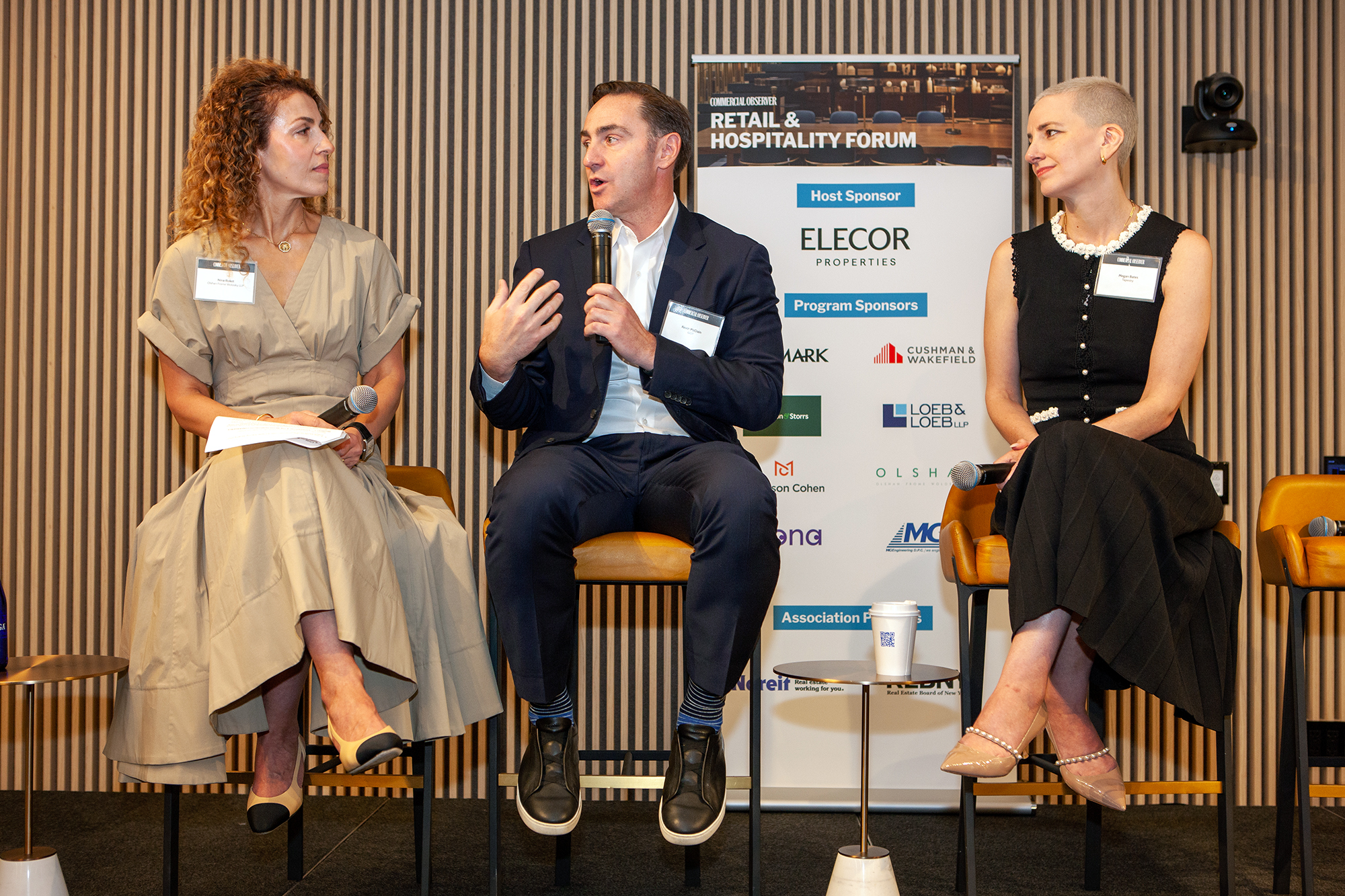 Kevin McCrain (center) responds to Nina Roket (left) on a panel with Megan Bates.