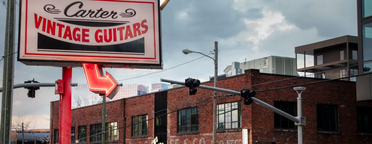 Carter Vintage Guitars sign and Two Hands in Paseo South Gulch.