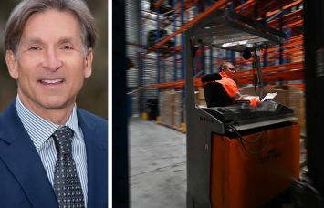 Arden Logistic Parks's Craig Spencer and an employee working inside a warehouse.