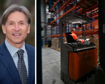 Arden Logistic Parks's Craig Spencer and an employee working inside a warehouse.