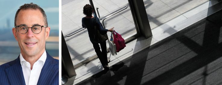 Related Companies's Jeff Blau and a shopper carrying bags at the Shops at Columbus Circle.