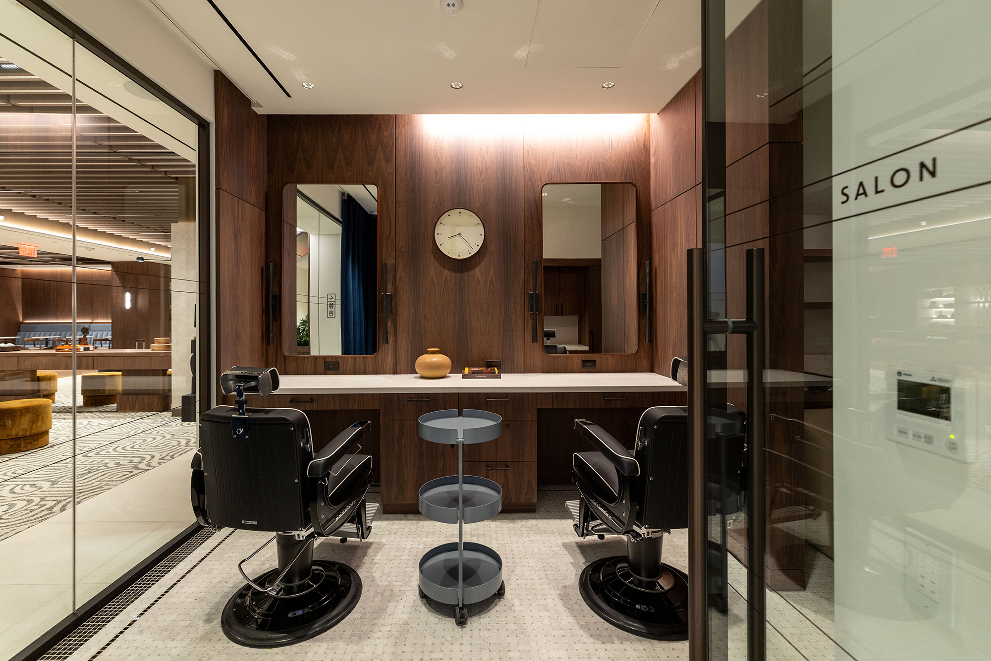 A barber shop and blow dry salon inside 99 Park Avenue.