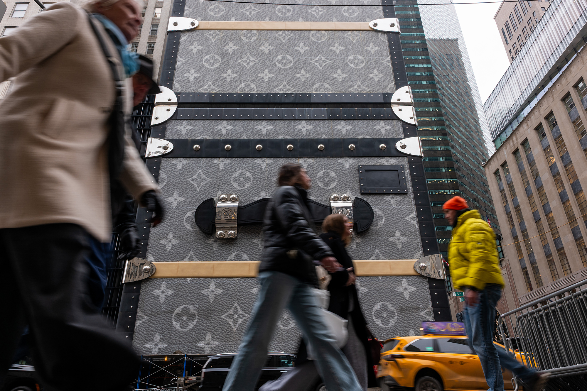 People walk along Fifth Avenue in midtown Manhattan.