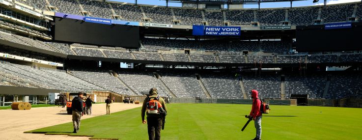 Workers install the pitch at New York New Jersey Stadium (temporarily renamed from MetLife stadium) in East Rutherford, N.J. ahead of the 2026 FIFA World Cup.