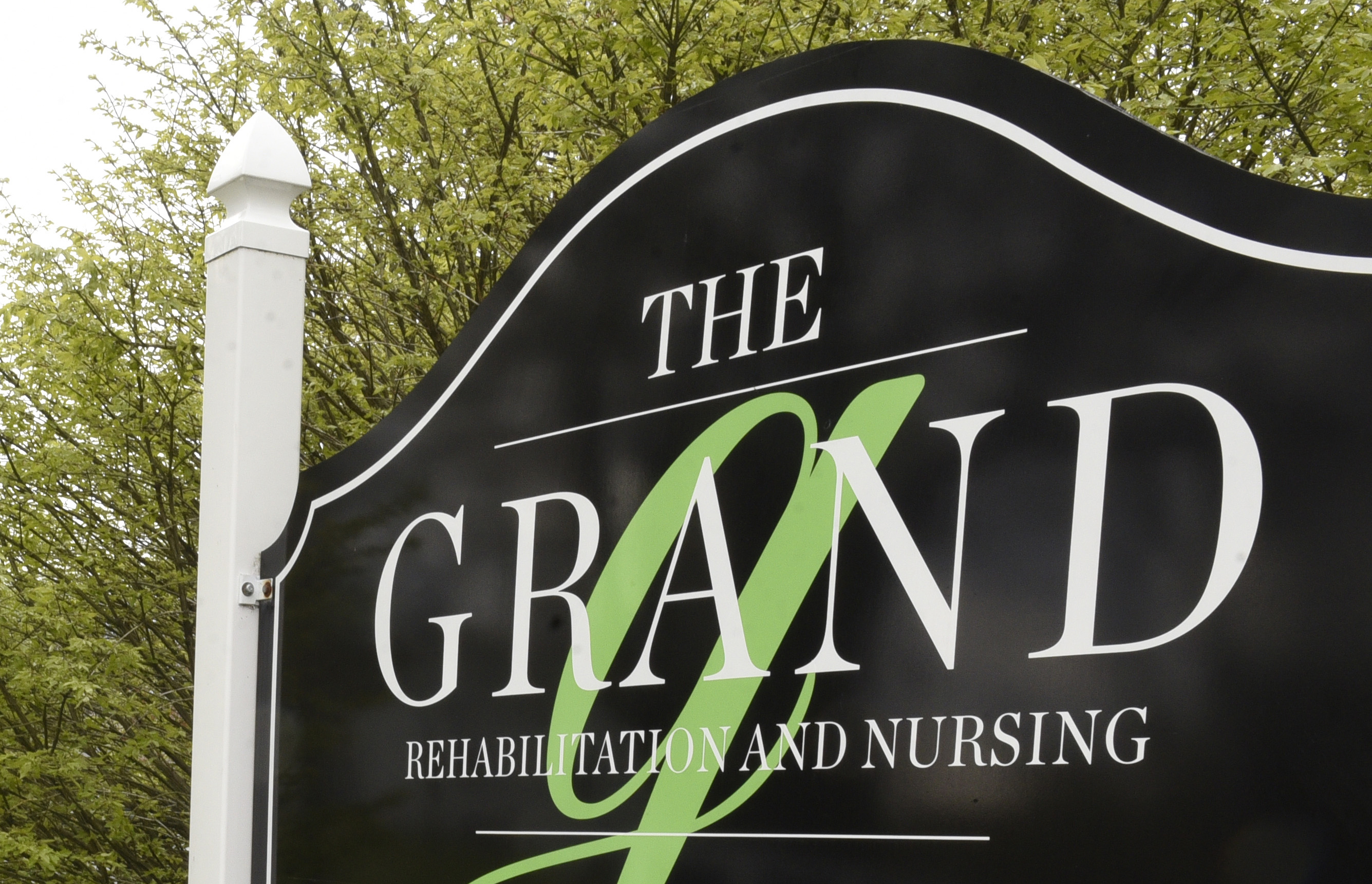 A sign outside of a The Grand Rehabilitation and Nursing location.