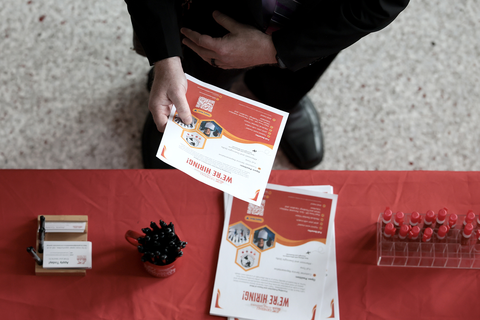 A job seeker visits a recruiting booth at a job fair held in Florida.