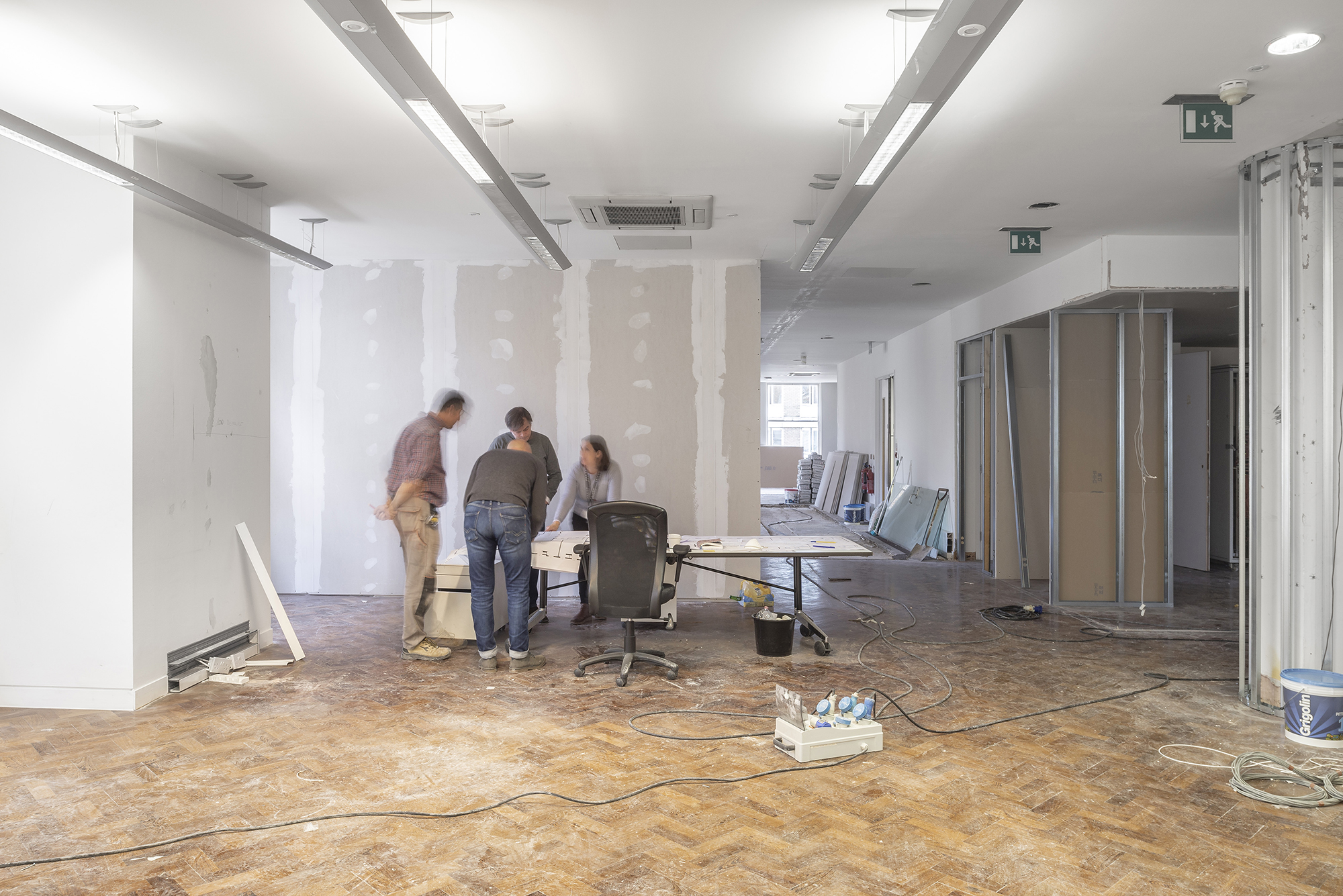 Strip out phase of an office site meeting in progress.