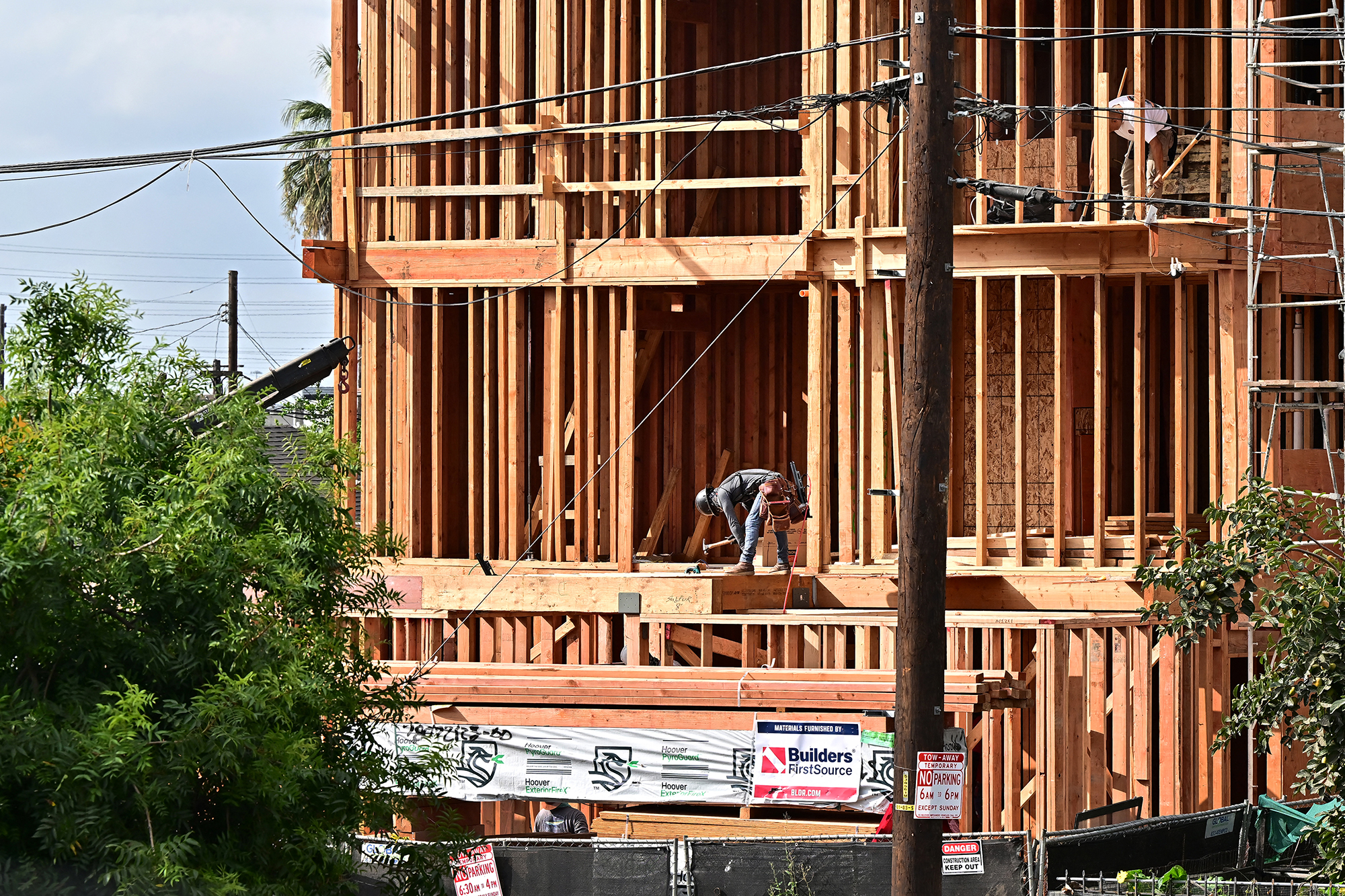 Construction workers working in the frame of a development in Los Angeles.