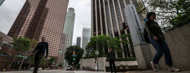 Pedestrians was passed Bank of America Plaza at 333 South Hope Street in Los Angeles.