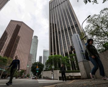 Pedestrians was passed Bank of America Plaza at 333 South Hope Street in Los Angeles.