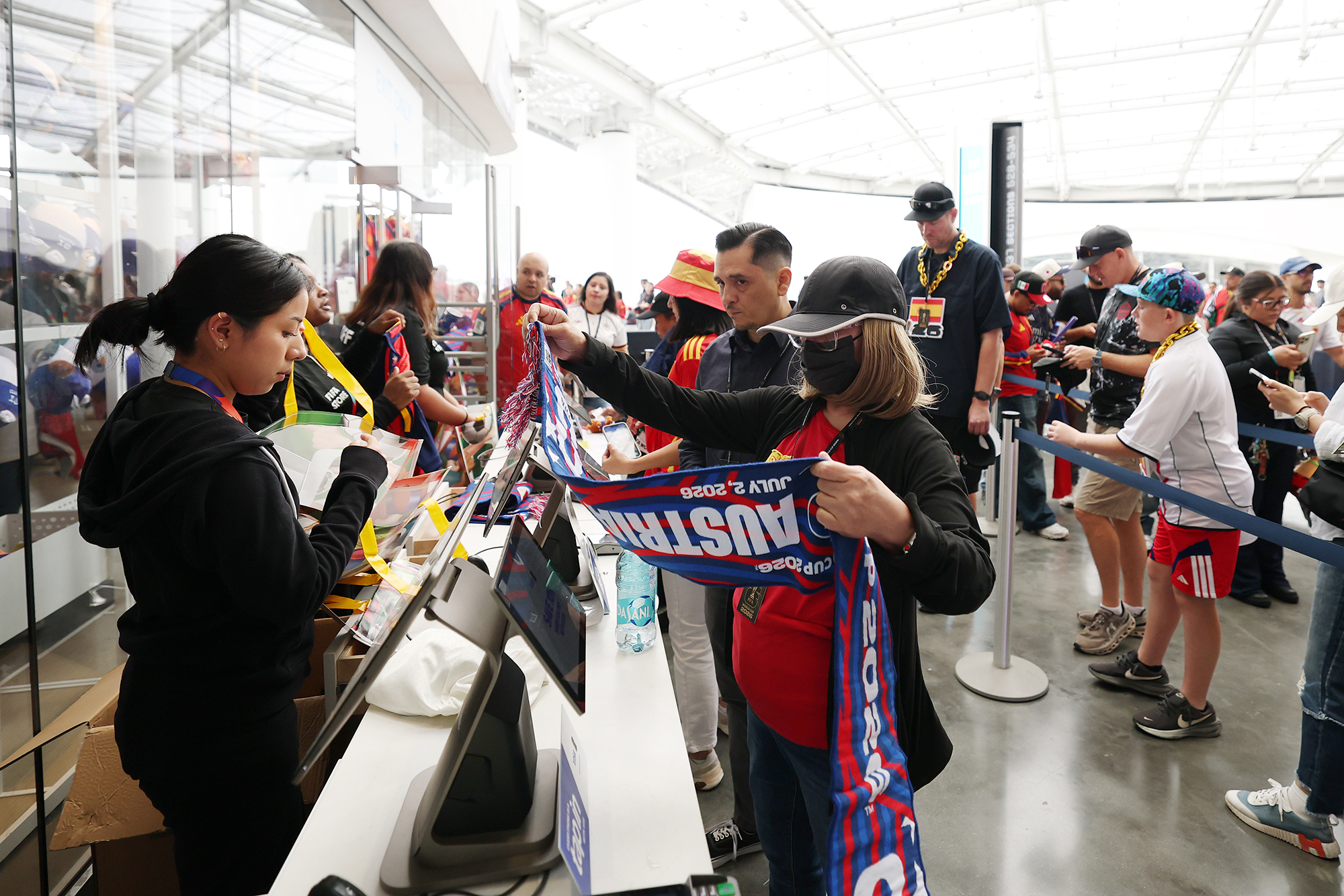 Fans purchase merchandise before a FIFA World Cup match at Los Angeles Stadium in Inglewood, Calif.