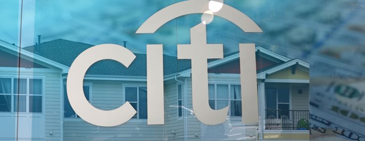 An illustration of a Citi logo overlayed on multifamily housing and U.S. currency.