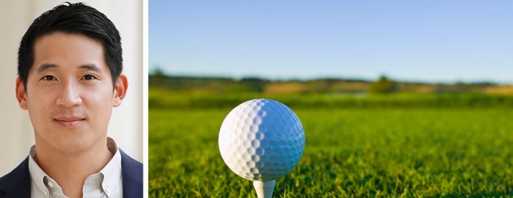Ohana Real Estate's Head of Acquisitions, Eddie Yu, and a golf ball on a tee at a golf course.