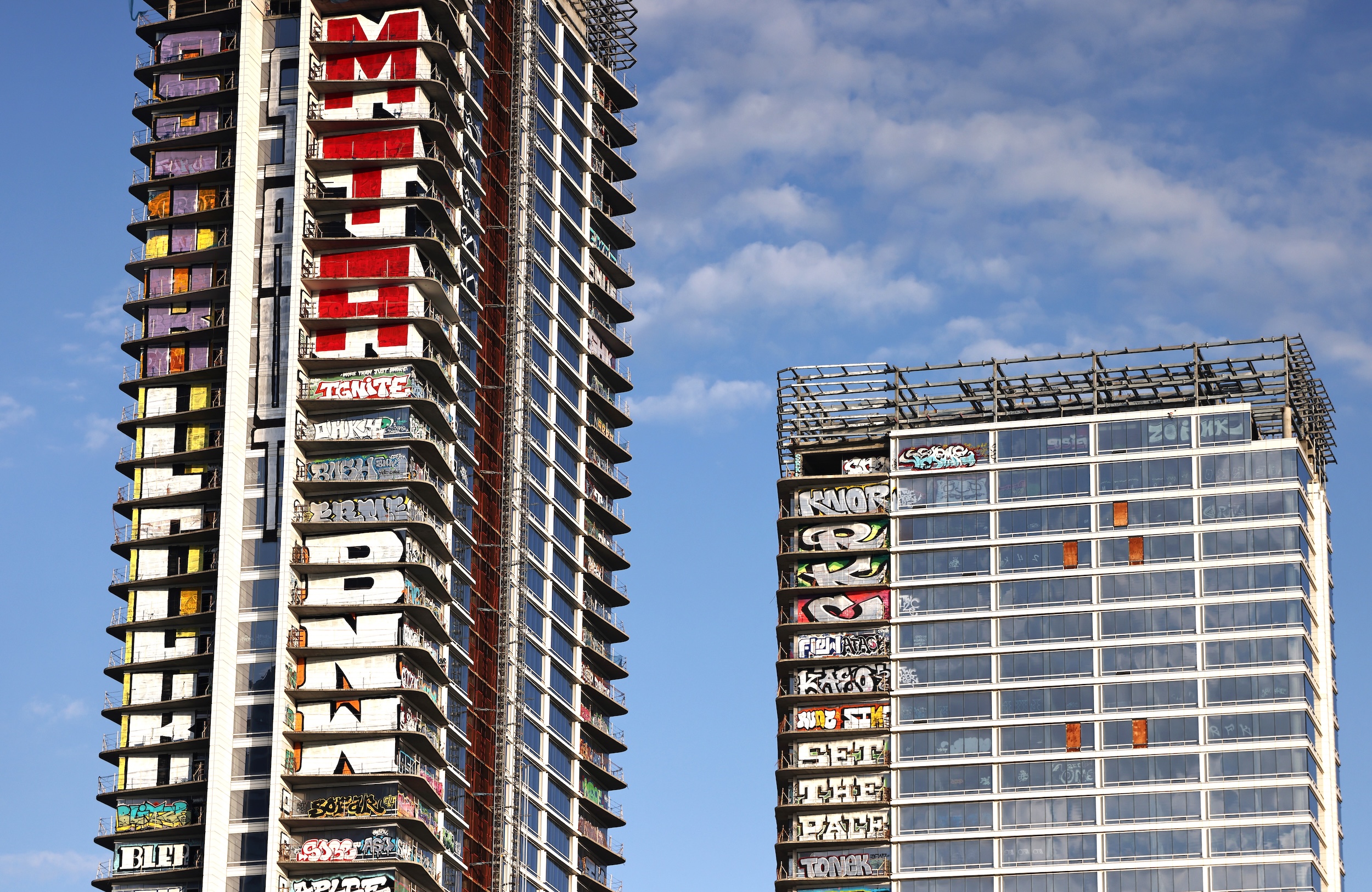 A view of the so-called Graffiti Towers, where graffiti writers tagged 40 floors of an unfinished luxury skyscraper development in March 2024 in Los Angeles, California. Construction of the $1 billion Oceanwide Plaza luxury real estate development stalled in 2019 after a China-based developer ran out of funding, leaving the three-tower project unfinished amid a housing crisis in the city. The project is located across the street from the Crypto.com Arena.